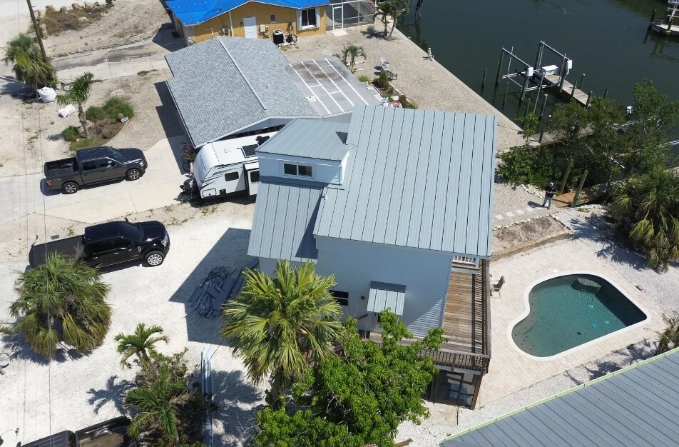 Aerial photo of residential metal roof installed by Cathedral Roofing in Florida

